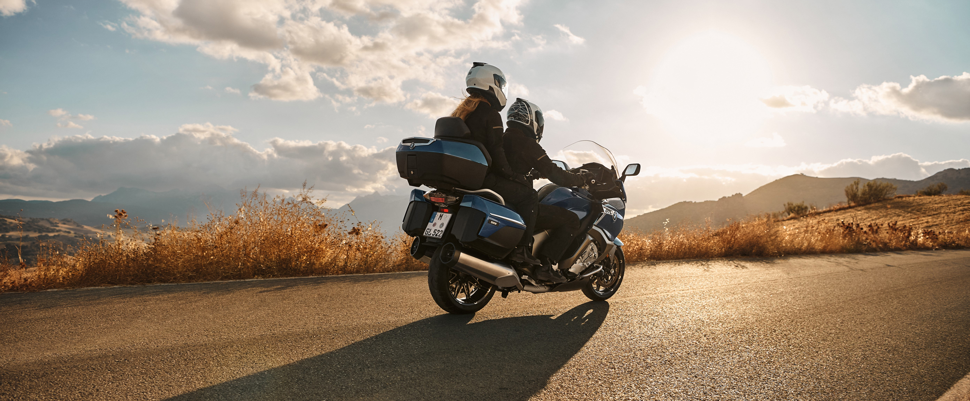 BMW Touring Motorcycle Riding into sunset