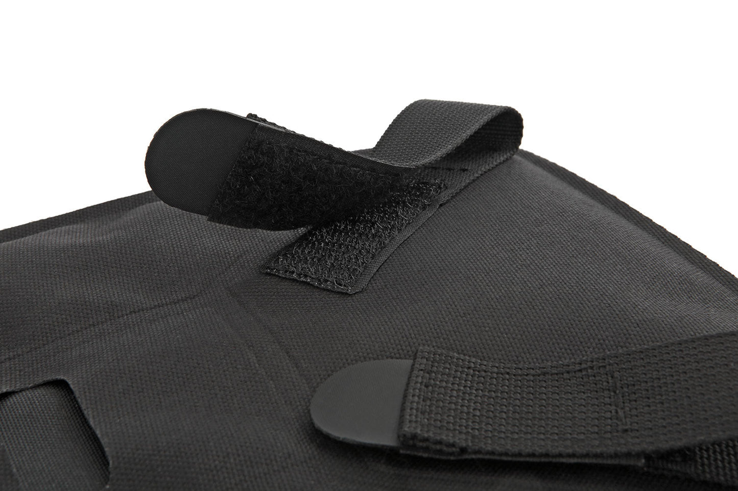 Black tactical vest with straps on a white background