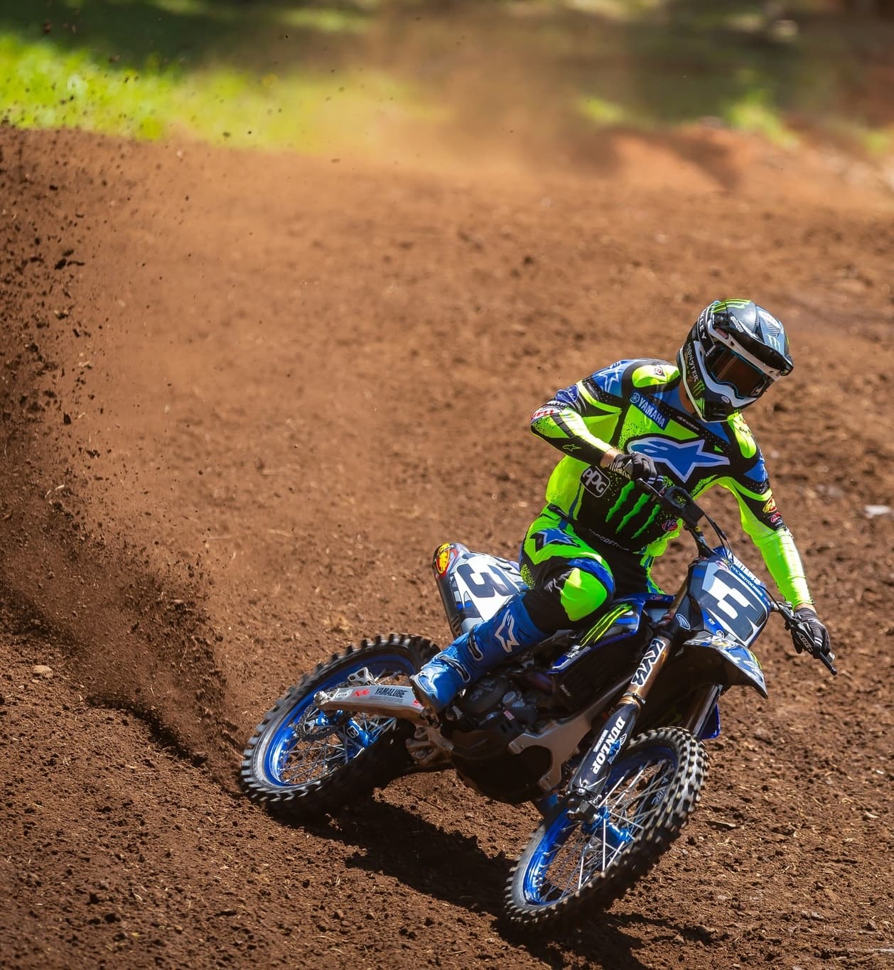 Motocross rider in action on a dirt track