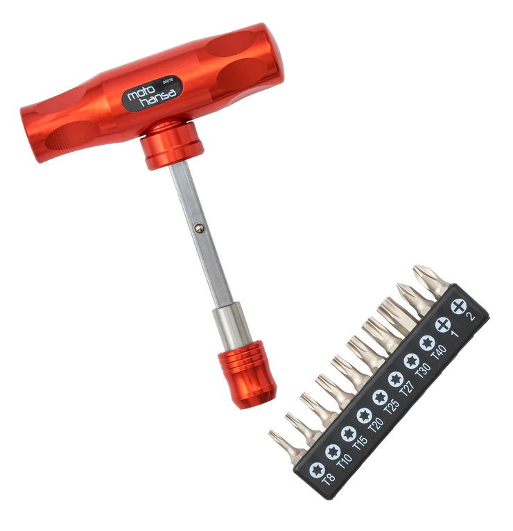 Red tool with multiple drill bits on a white background