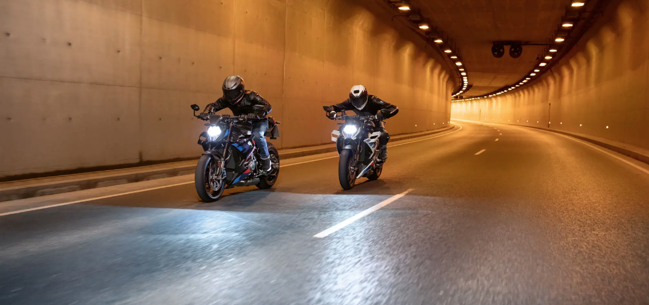 BMW Roadster motorcycles riding through tunnel