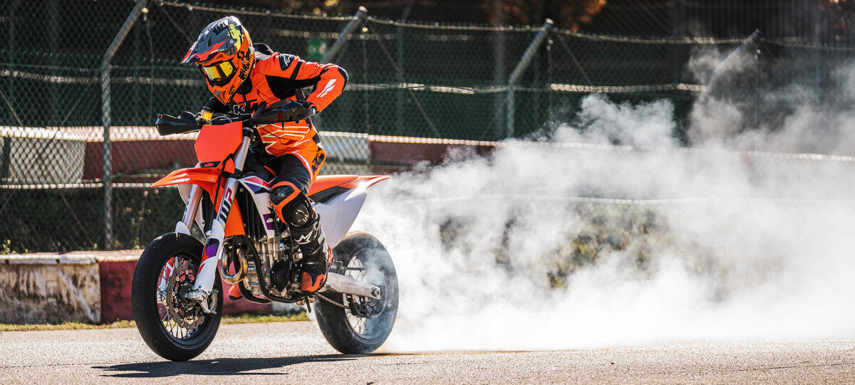 KTM supermoto motorcycle burnout on track